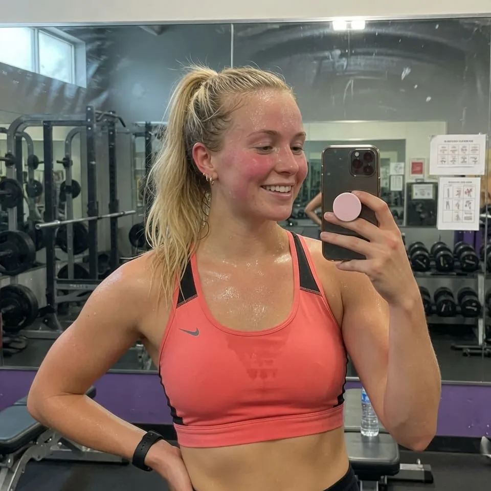 Realistic photo of a 26-year-old athletic woman with blonde ponytail in sportswear — before neural network